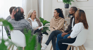 people in group therapy in 12 step program